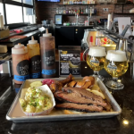 Fort Collins Brewery Tap Takeover at Smok BBQ. Local business collaboration displayed with maxline beers on tap at smok, with a full plate of bbq foods.